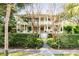 Two-story home with wrap-around porch and lush landscaping at 1738 Ion Ave, Sullivans Island, SC 29482