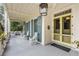 Spacious front porch features rocking chairs and access to the home's entrance at 1738 Ion Ave, Sullivans Island, SC 29482