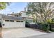 Two-car garage with white doors and a long driveway at 1738 Ion Ave, Sullivans Island, SC 29482