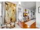 Elegant hallway with hardwood floors, large artwork, and a console table at 1738 Ion Ave, Sullivans Island, SC 29482