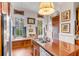 Kitchen with wood cabinets, granite countertops, and built-in window seat at 1738 Ion Ave, Sullivans Island, SC 29482