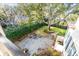 Stone patio with seating area and large shade tree at 1738 Ion Ave, Sullivans Island, SC 29482