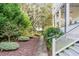 Stone pathway meanders through a beautifully landscaped side yard at 1738 Ion Ave, Sullivans Island, SC 29482