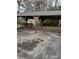A carport with a concrete slab and wooden supports at 1972 Green Park Ave, Charleston, SC 29414