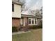 Brick ranch house with a covered entryway, landscaping, and multiple windows at 1972 Green Park Ave, Charleston, SC 29414