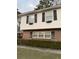 Two-story house with brick and vinyl siding, featuring multiple windows and landscaping at 1972 Green Park Ave, Charleston, SC 29414