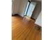 Hardwood floor living room with an open door to the entryway at 1972 Green Park Ave, Charleston, SC 29414