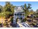 Two-story house with front porch and attached garage at 2166 Brown Pelican Ln, Charleston, SC 29412