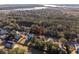 Aerial view showcasing a house in a wooded neighborhood at 2166 Brown Pelican Ln, Charleston, SC 29412