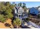 Two-story house with front porch and attached garage at 2166 Brown Pelican Ln, Charleston, SC 29412