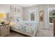 Charming bedroom with a floral comforter and plenty of natural light at 2166 Brown Pelican Ln, Charleston, SC 29412