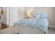 Bright bedroom with white wooden bed frame and blue bedding at 2166 Brown Pelican Ln, Charleston, SC 29412