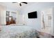 King bedroom with ensuite bathroom and mounted TV at 2166 Brown Pelican Ln, Charleston, SC 29412