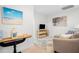 Bright bonus room features a cozy sitting area, TV, and decorative artwork at 2166 Brown Pelican Ln, Charleston, SC 29412