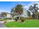 Two-story house with gray siding, white porch, and a landscaped lawn at 2166 Brown Pelican Ln, Charleston, SC 29412