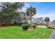 Two-story house with gray siding, white porch, and a landscaped lawn at 2166 Brown Pelican Ln, Charleston, SC 29412