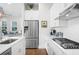 Stainless steel refrigerator and gas cooktop in a bright kitchen at 2166 Brown Pelican Ln, Charleston, SC 29412