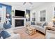 Bright living room with fireplace, two sofas, and a coffee table at 2166 Brown Pelican Ln, Charleston, SC 29412