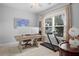 Home office with a desk, two monitors and treadmill at 2166 Brown Pelican Ln, Charleston, SC 29412