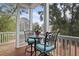 Relaxing screened porch with outdoor seating and wooded views at 2166 Brown Pelican Ln, Charleston, SC 29412