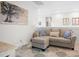 Spacious sitting area with comfortable sofa and ottoman, perfect for relaxing at 2166 Brown Pelican Ln, Charleston, SC 29412