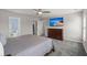 Bright bedroom with ensuite bathroom access and large TV at 230 Wathen Dr, Goose Creek, SC 29445