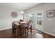 Bright dining room with hardwood floors and access to backyard at 230 Wathen Dr, Goose Creek, SC 29445