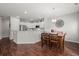 Kitchen features hardwood floors, an island, and white cabinets at 230 Wathen Dr, Goose Creek, SC 29445