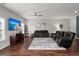 Open living room with hardwood floors, a large TV, and comfortable seating at 230 Wathen Dr, Goose Creek, SC 29445