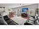 Open living room with hardwood floors, a large TV, and comfortable seating at 230 Wathen Dr, Goose Creek, SC 29445