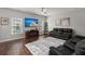 Open living room with hardwood floors, a large TV, and comfortable seating at 230 Wathen Dr, Goose Creek, SC 29445