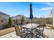 Cozy patio furniture set under an umbrella at 230 Wathen Dr, Goose Creek, SC 29445