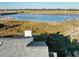 Gray shingle roof and white siding with waterfront views at 2335 Tall Sail Dr # 508H, Charleston, SC 29414