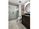 Bathroom with walk-in shower and dark vanity at 2335 Tall Sail Dr # 508H, Charleston, SC 29414