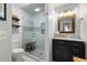 Modern bathroom with glass shower and dark vanity at 2335 Tall Sail Dr # 508H, Charleston, SC 29414
