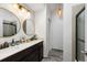 Modern bathroom with dual sinks, a frameless glass shower, and updated lighting at 2335 Tall Sail Dr # 508H, Charleston, SC 29414