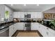 Well-equipped kitchen featuring white cabinets and ample counter space at 2335 Tall Sail Dr # 508H, Charleston, SC 29414