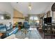 Elegant living room with fireplace, spiral staircase, and deck access at 2335 Tall Sail Dr # 508H, Charleston, SC 29414