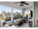 Bright sunroom with exercise equipment and water views at 2335 Tall Sail Dr # 508H, Charleston, SC 29414