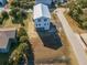 Aerial view of a modern two-story home and yard at 305 Matilda St, Edisto Beach, SC 29438
