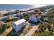 Aerial view of a beachfront home with ocean access and surrounding neighborhood at 305 Matilda St, Edisto Beach, SC 29438