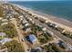 Aerial view of beach homes with oceanfront access and community at 305 Matilda St, Edisto Beach, SC 29438
