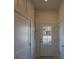 Clean hallway with white walls and doors to other rooms at 305 Matilda St, Edisto Beach, SC 29438
