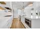 Open concept kitchen with island and stainless steel appliances at 305 Matilda St, Edisto Beach, SC 29438