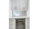 Built-in wine cooler and white shaker cabinets at 305 Matilda St, Edisto Beach, SC 29438