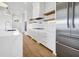 Modern kitchen with white cabinets and stainless steel appliances at 305 Matilda St, Edisto Beach, SC 29438