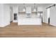 Modern kitchen with white cabinets and island at 305 Matilda St, Edisto Beach, SC 29438