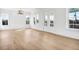 Spacious living area with hardwood floors and access to deck at 305 Matilda St, Edisto Beach, SC 29438