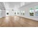 Bright and spacious living room featuring hardwood floors and multiple windows at 305 Matilda St, Edisto Beach, SC 29438