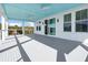 Large porch with sliding glass doors, cable railing, and a blue ceiling at 305 Matilda St, Edisto Beach, SC 29438
